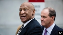 FILE - Bill Cosby departs the Montgomery County Courthouse after a pretrial hearing in his sexual assault case in Norristown, Pennsylvania.