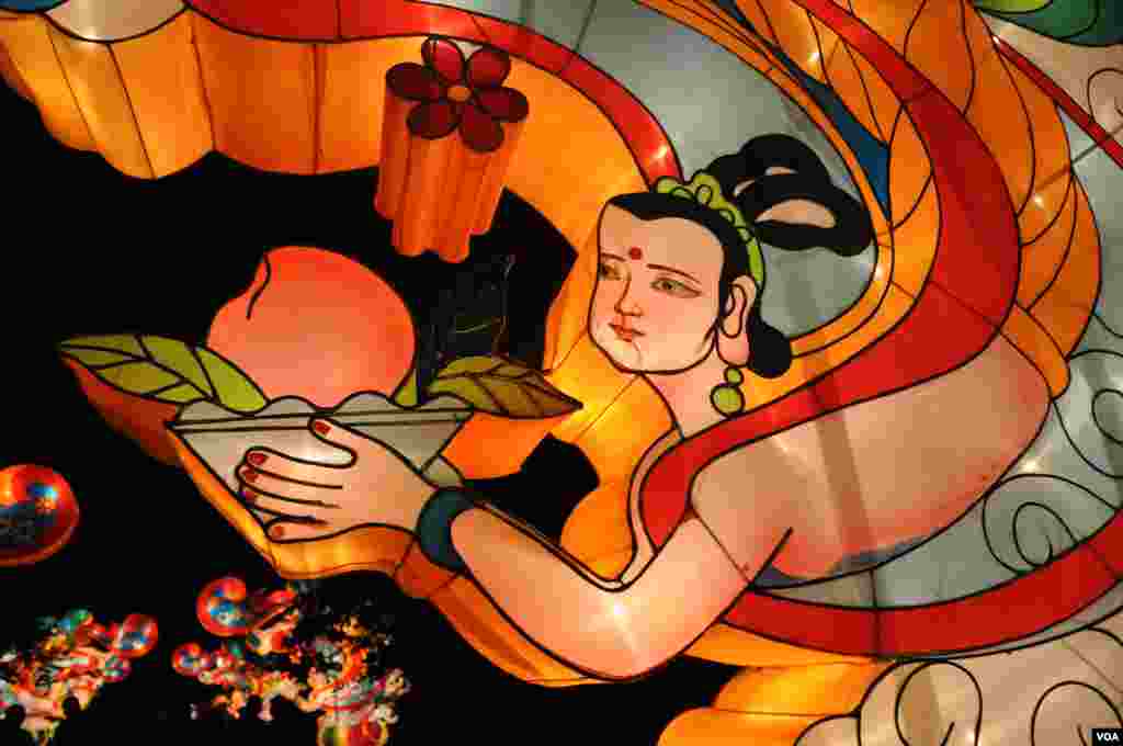 This detail is from one of several lanterns featuring Flying Asperas, the supernatural maidens of Buddhist mythology. (V. LaCapra/VOA)