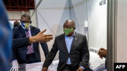 South African President Cyril Ramaphosa visits the COVID-19 coronavirus treatment facilities at the Expo Center in Johannesburg, South Africa, April 24, 2020. 