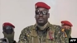 A screengrab taken from footage sent to AFP by a military source shows Guinean Colonel Mamady Doumbouya delivering a speech following the dissolution of the government during a coup d'etat in Conakry, September 5, 2021.