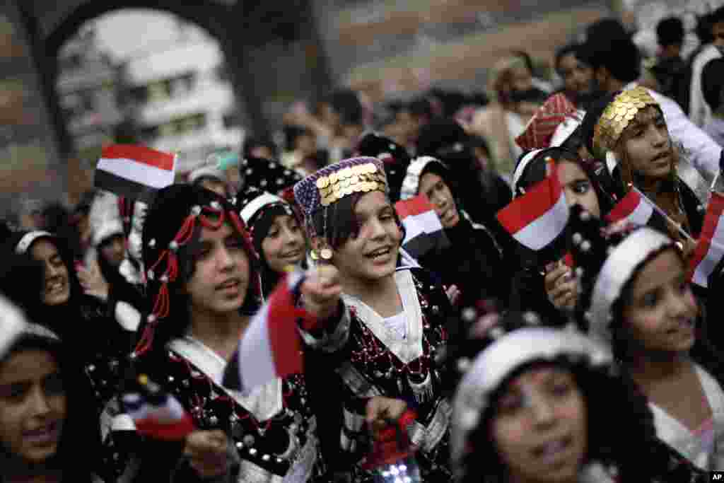 Yemeni girls wearing traditional costumes attend a festival to welcome the month of Ramadan in the old city of Sanaa, Yemen, July 8, 2013.