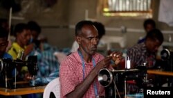 FILE - Eritrean refugees sew cloth during a training in Hitsats refugee camp during the visit of the Crown Prince of Norway, Haakon Magnus and Crown Princess Mette Marit near Eritrean boarder, Tigrai region, Ethiopia, November 9, 2017.