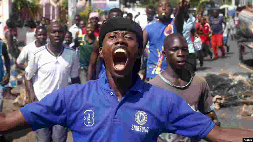 Crowds poured onto the streets of Burundi's capital of Bujumbura to celebrate, May 13, 2015, after a general said he was dismissing President Pierre Nkurunziza for violating the constitution by seeking a third term in office, a Reuters witness said.