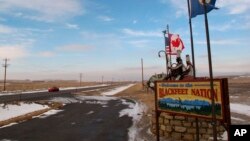 FILE - A sign welcoming visitors to the Blackfeet Indian reservation in Browning, Mont., Dec. 12, 2012.