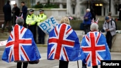 People celebrate Britain leaving the EU on Brexit day at Parliament Square in London, Britain January 31, 2020. REUTERS/Henry Nicholls