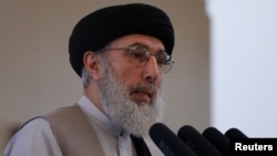 Afghan warlord Gulbuddin Hekmatyar speaks during a welcoming ceremony at the presidential palace in Kabul, Afghanistan, May 4, 2017.