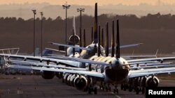FILE - Airplanes are parked at the airport in Frankfurt, Germany, March 15, 2020.