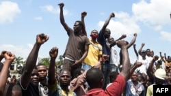 Protesters chant solidarity songs as they block the Lagos-Ibadan expressway, railing against police brutality and the killing of protesters by the military, at Magboro, Ogun state, Nigeria, Oct. 21, 2020.
