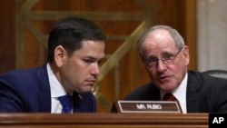 Senate Foreign Relations Committee Chairman Sen. James Risch, R-Idaho, right, talks with Sen. Marco Rubio, R-Fla., left, during a hearing with Secretary of State Mike Pompeo on Capitol Hill in Washington, Wednesday, April 10, 2019, to review the FY…