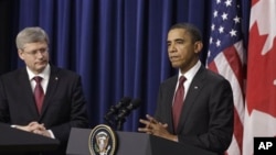 President Barack Obama and Canada's Prime Minister Stephen Harper take part in a joint news conference after their meeting at the White House in Washington, Friday, Feb. 4, 2011
