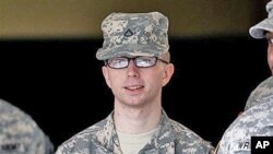 Army Private First Class Bradley Manning - a low-ranking intelligence analyst charged in the biggest leak of classified information in US history - is escorted from a courthouse in Fort Meade, Maryland, December 22, 2011.