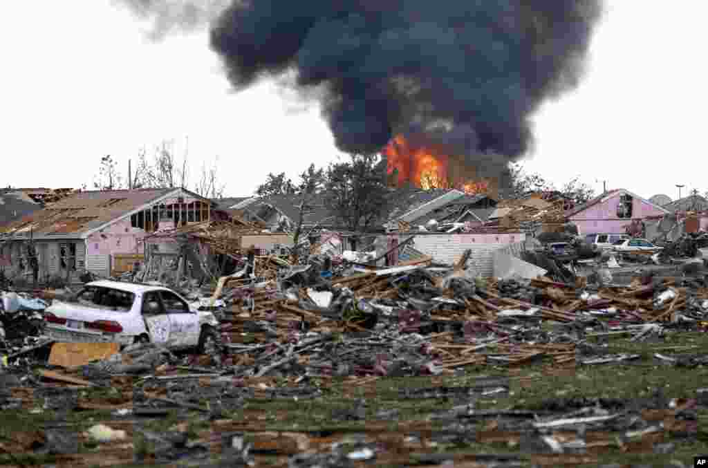A fire burns in the Tower Plaza Addition following a tornado in Moore, Oklahoma, May 20, 2013.