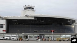 The central terminal Seattle-Tacoma International Airport is shown, Jan. 26, 2016, in Seattle. Former U.S. intelligence officer Ron Rockwell Hansen was arrested on June 3, 2018, while preparing to board a connecting flight to China.