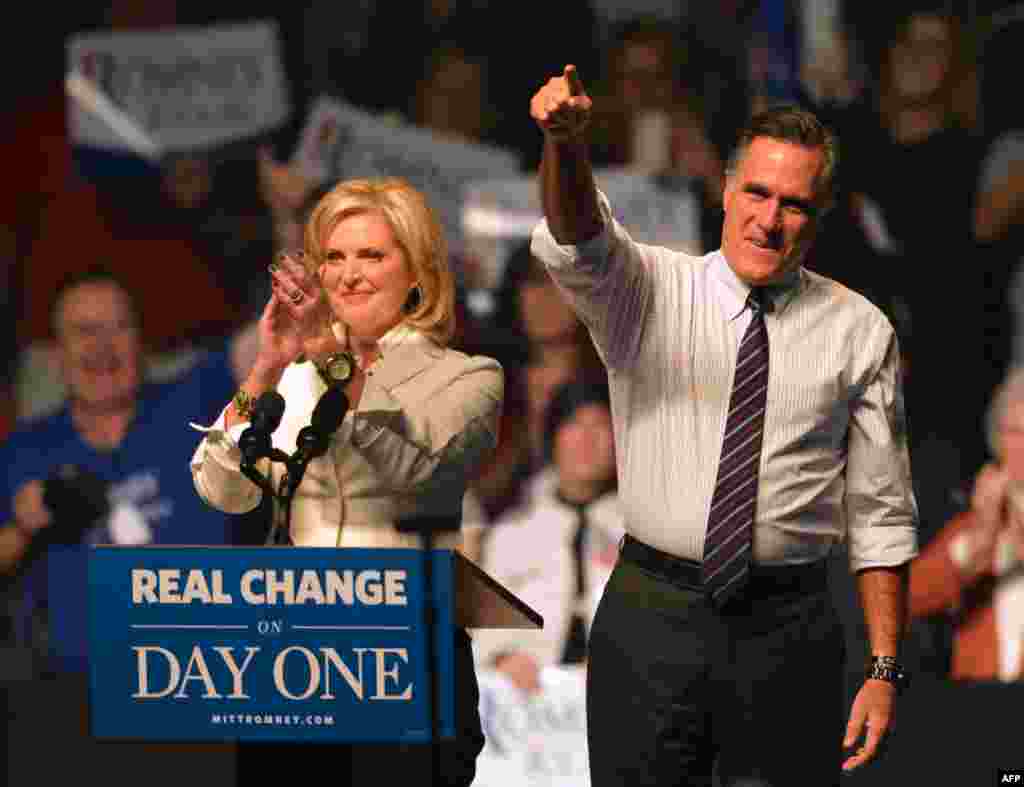 U.S. Republican Presidential candidate Mitt Romney (L) and his wife Ann Romney (R) at a rally late November 5, 2012, at the Verizon Wireless Arena in Manchester, New Hampshire.