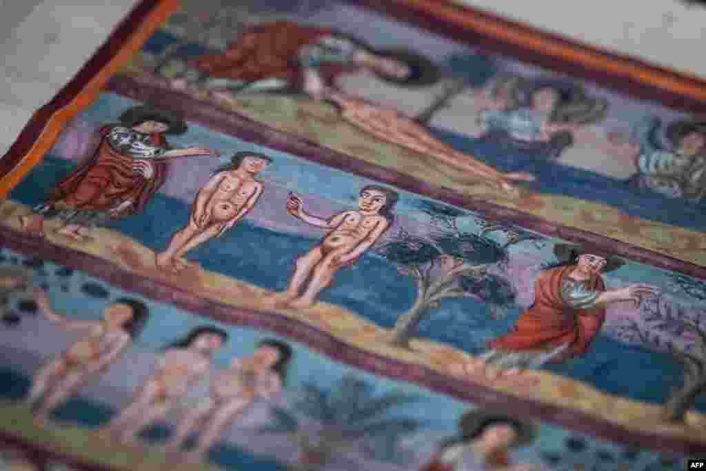 This photograph shows a detail of the Moutier-Grandval Bible, a 9th century illustrated bible, one of the oldest fully preserved bibles in the world, during the press day of the exhibition "Sur les traces d’un chef-d’oeuvre: La Bible de Moutier-Granval"