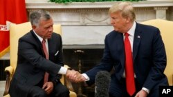 President Donald Trump meets with King Abdullah II of Jordan in the Oval Office of the White House, June 25, 2018, in Washington.