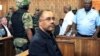FILE - Mozambique's former finance minister Manuel Chang appears in court during an extradition hearing in Johannesburg, South Africa, Jan. 8, 2019. 