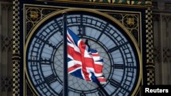 FILE - A Union flag flies in front of the Big Ben clock face abover the Houses of Parliament in central London, Britain, April 18, 2017.