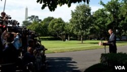 El presidente Barack Obama habla ante los medios en los Jardines de la Casa Blanca antes de partir a la Cumbre del G20.