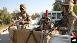 FILE - Yemeni soldiers stand guard in Marib, Yemen, Feb. 2, 2018. A missile strike launched by Shi'ite rebels killed at least 70 troops at an army camp in Marib, Jan. 18, 2020.