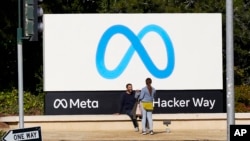 FILE - A Meta sign outside of the company's headquarters in Menlo Park, Calif. 