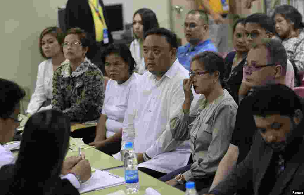 Family members of slain transgender Jennifer Laude attend the preliminary investigations into Jennifer's death with her lawyers at the Justice Hall in Olongapo City, north of Manila, Oct. 21, 2014.