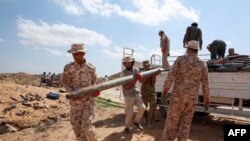 Military engineers of the U.N.-recognized Libyan Government of National Accord (GNA) arrive at the site where ammunition will be disposed in the Libyan capital Tripoli on October 12, 2020. (Photo by Mahmud TURKIA / AFP)