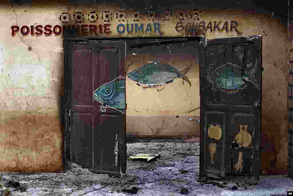 A Muslim owned fish shop stands looted in the Miskin district of Bangui, Feb. 4, 2014.