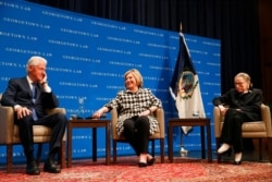Former President Bill Clinton, left, Hillary Clinton, and Supreme Court Justice Ruth Bader Ginsburg, Oct. 30, 2019, in Washington.