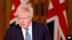 Britain's Prime Minister Boris Johnson speaks during a media briefing in Downing Street, London, Monday Dec. 21, 2020. 