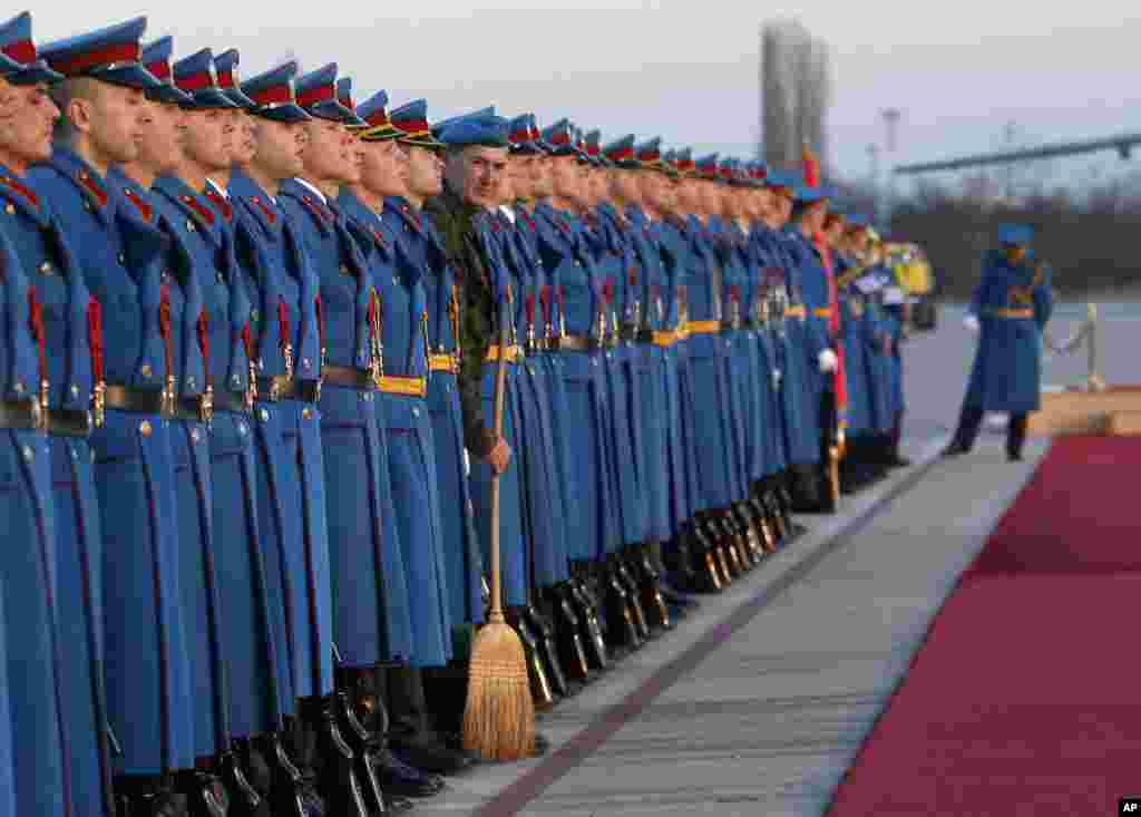 Members of the Serbian Honor guard prepare for the welcoming ceremony for Hungary's Prime Minister Viktor Orban, at the Constantine the Great Airport, in the town of Nis, Serbia.