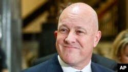 New Zealand National Party leader and Prime Minister-elect Christopher Luxon talks to the media at parliament in Wellington, New Zealand, Nov. 23, 2023. Three New Zealand political leaders on Thursday said they have reached an agreement to form the next government. 