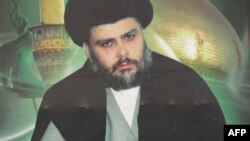 A giant portrait of Iraqi Shiite cleric Moqtada al-Sadr is displayed in Baghdad's Sadr City district, Feb. 16, 2014.