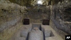 This photo provided by Egypt’s antiquities ministry shows one of the sarcophagi discovered in the village of Tuna al-Gabal, near the Nile Valley city of Minya. 