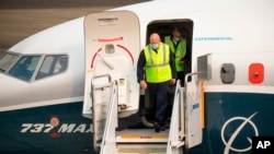FAA chief Steve Dickson walks out of a Boeing 737 Max after concluding a test flight and landing at Boeing Field in Seattle, Sept. 30, 2020. 