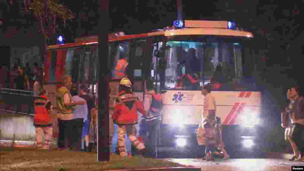 A screen grab taken from video footage shows people being evacuated onto a bus following a shooting rampage at the Olympia shopping mall in Munich, Germany July 22, 2016.