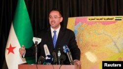 FILE - Syrian National Coalition spokesman Khaled Saleh speaks during a news conference in Istanbul,September 3, 2013.