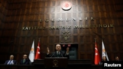 FILE - Turkish President Recep Tayyip Erdogan addresses members of parliament from his ruling AK Party (AKP) during a meeting at the Turkish parliament in Ankara, Turkey, March 6, 2018. 