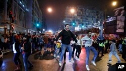 Washington Nationals fans celebrate in Washington after the team won Game 7 of baseball's World Series in Houston, Oct. 31, 2019.