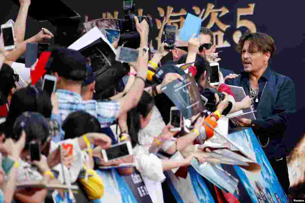 Actor Johnny Depp arrives for the global premiere of the film "Pirates of the Caribbean: Dead Men Tell No Tales," in Shanghai, China.