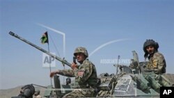 Afghan National Army soldiers prepare for a military exercise near Kabul on April 30, 2014. Afghan troops this week reportedly killed at least 60 insurgents near the Pakistani border. 