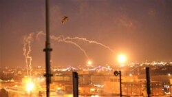U.S. Army AH-64 Apache helicopters from 1st Battalion, 227th Aviation Regiment, 34th Combat Aviation Brigade, launch flares as they conduct overflights of the U.S. Embassy in Baghdad, Dec. 31, 2019.