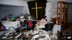 In this photo taken Sunday, June 3, 2018, the demolished house church is seen in the city of Zhengzhou in central China's Henan province. Under President Xi Jinping, believers are seeing their freedoms shrink even as the country undergoes a religious revival. (AP/Ng Han Guan)