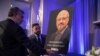 Mongi Dhaouadi (L) and Ahmed Bedier set up an image of slain Saudi journalist Jamal Khashoggi before an event to remember Khashoggi, a columnist for The Washington Post who was killed inside the Saudi Consulate in Istanbul on Oct. 2, in Washington, Nov. 2, 2018.