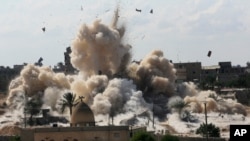  In this Oct. 29, 2014, file, photo, smoke rises after Egyptian army demolished houses on the Egyptian side on border town of Rafah.
