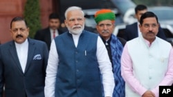 Prime Minister Narendra Modi with his cabinet colleagues arrive at the Parliament House on the opening day of the budget session in New Delhi, Jan. 31, 2020.