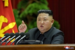North Korean leader Kim Jong Un speaks during the 5th Plenary Meeting of the 7th Central Committee of the Workers' Party of Korea in this undated photo released Dec. 28, 2019, by the Korean Central News Agency.