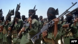 FILE - Fighters loyal to Somalia’s al-Shabab group perform military drills at a village in Lower Shabelle region, some 25 kilometers outside Mogadishu, Feb. 17, 2011.