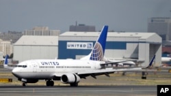 FILE - United Airlines passenger plane lands at Newark Liberty International Airport in Newark, New Jersey. 