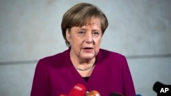 German chancellor Angela Merkel delivers a statement in Berlin, Jan. 7, 2018.